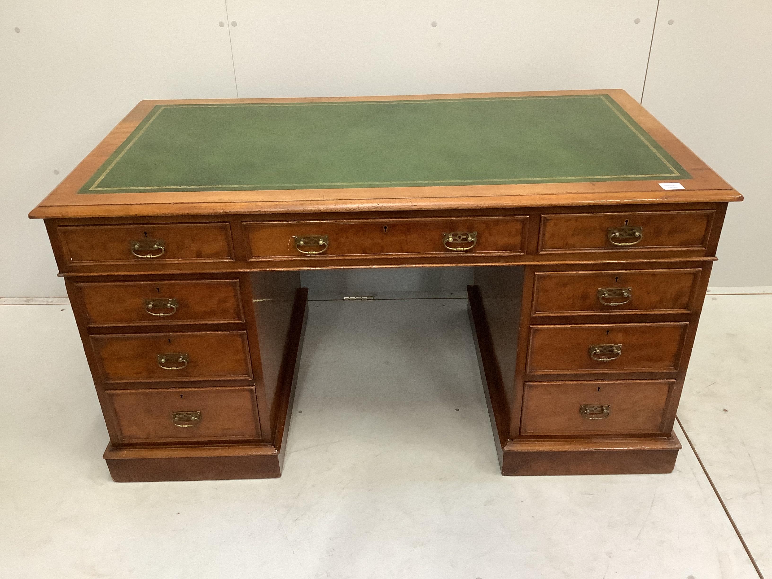 A late Victorian mahogany pedestal desk by Maple and Co., width 137cm, depth 74cm, height 74cm